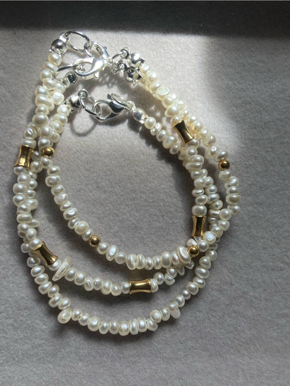 Delicate White Pearl Beaded Necklace with Gold Accents